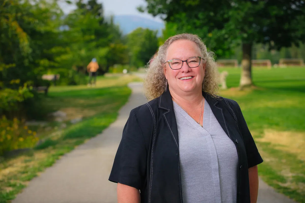 Janice Morrison smiling on a path in a Nelson park.